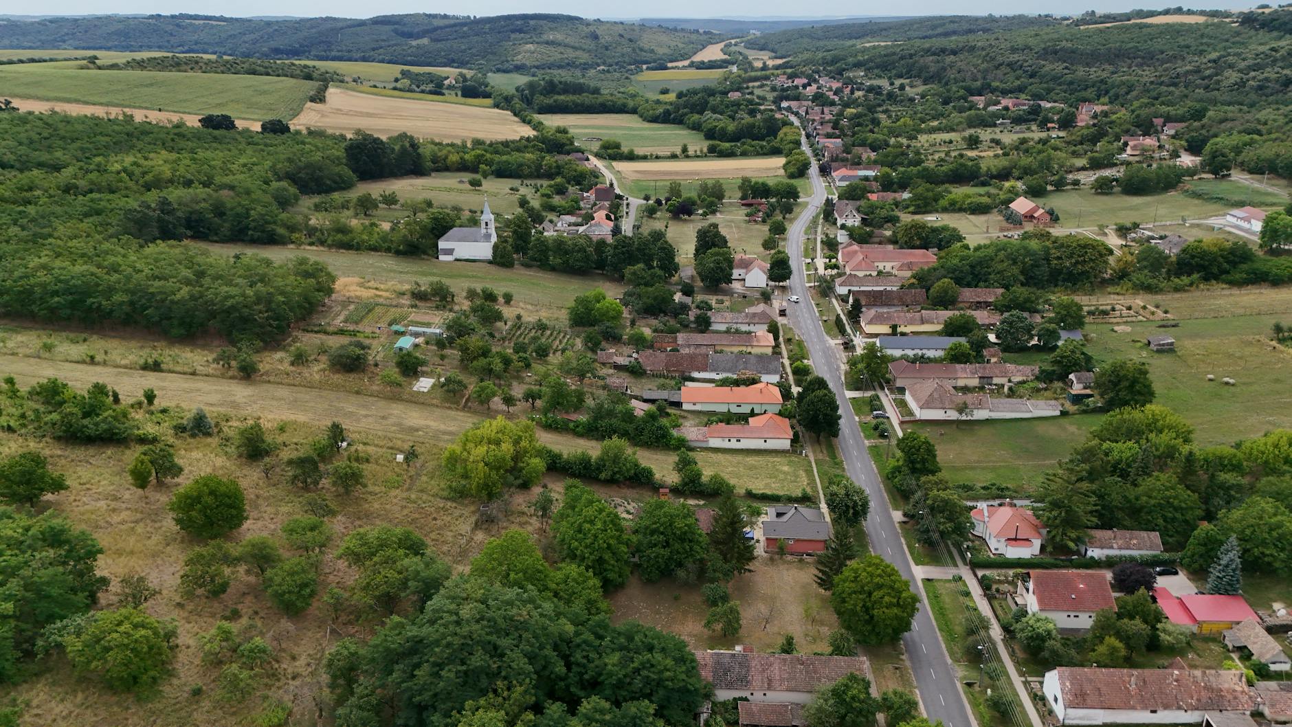 Aerial view of large-scale American agricultural farmland with crop rows stretching to the horizon