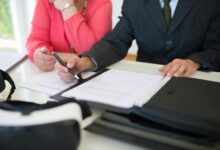 Attorney reviewing estate planning documents at a desk