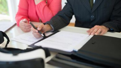 Attorney reviewing estate planning documents at a desk