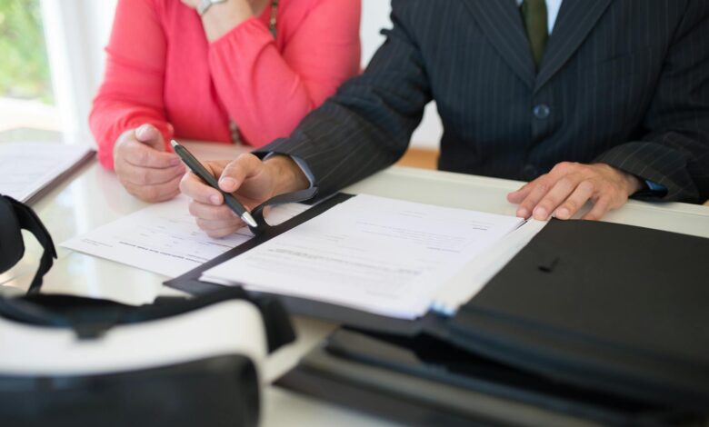 Attorney reviewing estate planning documents at a desk