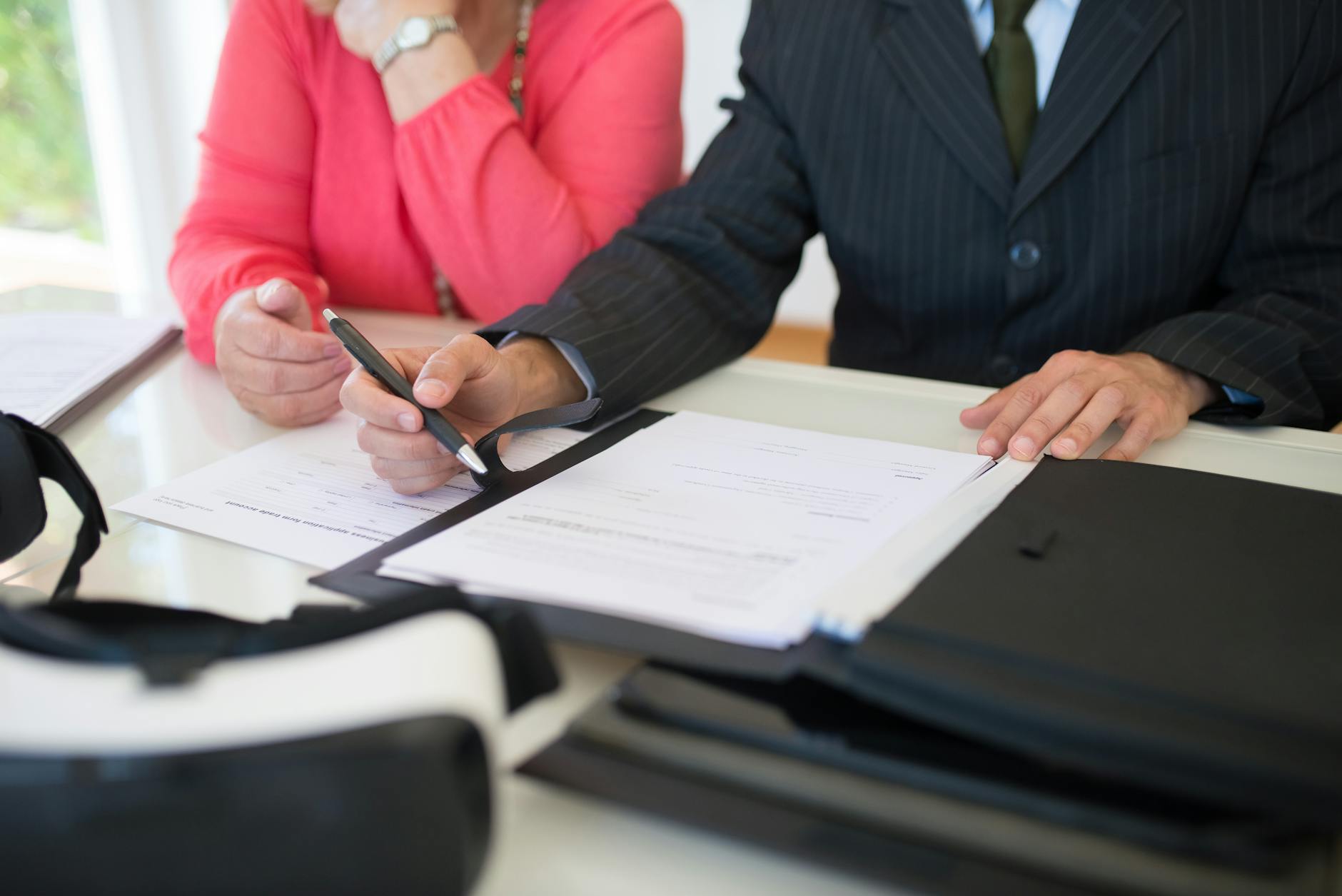Attorney reviewing estate planning documents at a desk
