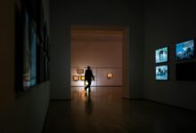 Modern art gallery with large paintings displayed on white walls representing high-value art collections used as collateral