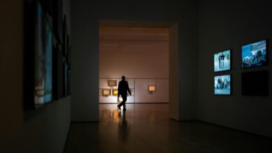 Modern art gallery with large paintings displayed on white walls representing high-value art collections used as collateral