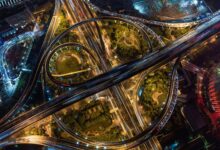 Aerial view of a multi-lane toll highway stretching into the distance