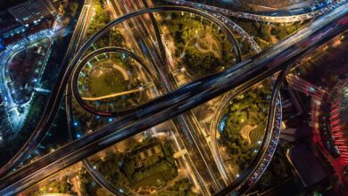 Aerial view of a multi-lane toll highway stretching into the distance