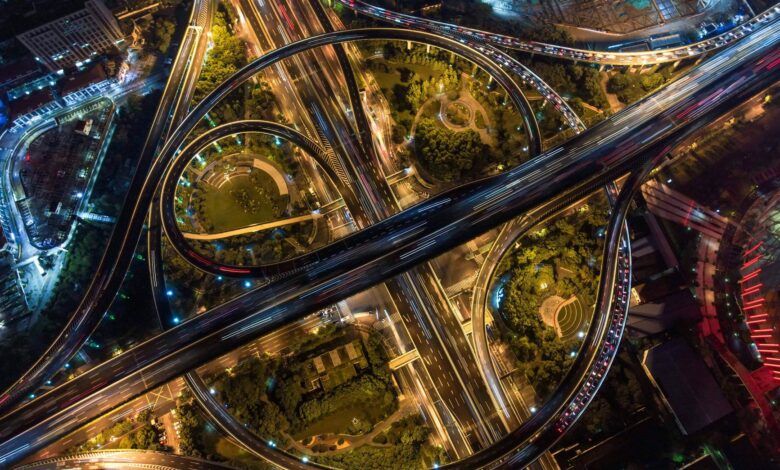 Aerial view of a multi-lane toll highway stretching into the distance