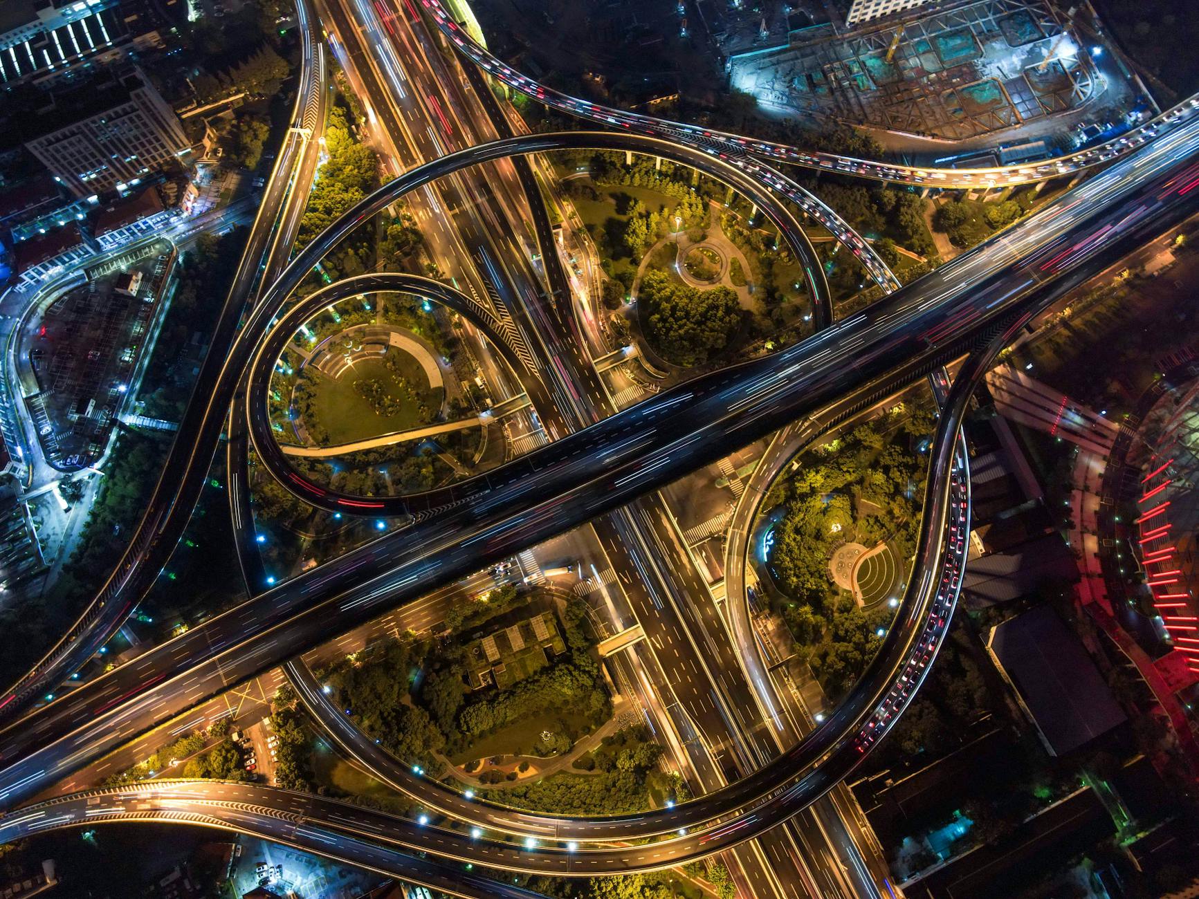 Aerial view of a multi-lane toll highway stretching into the distance
