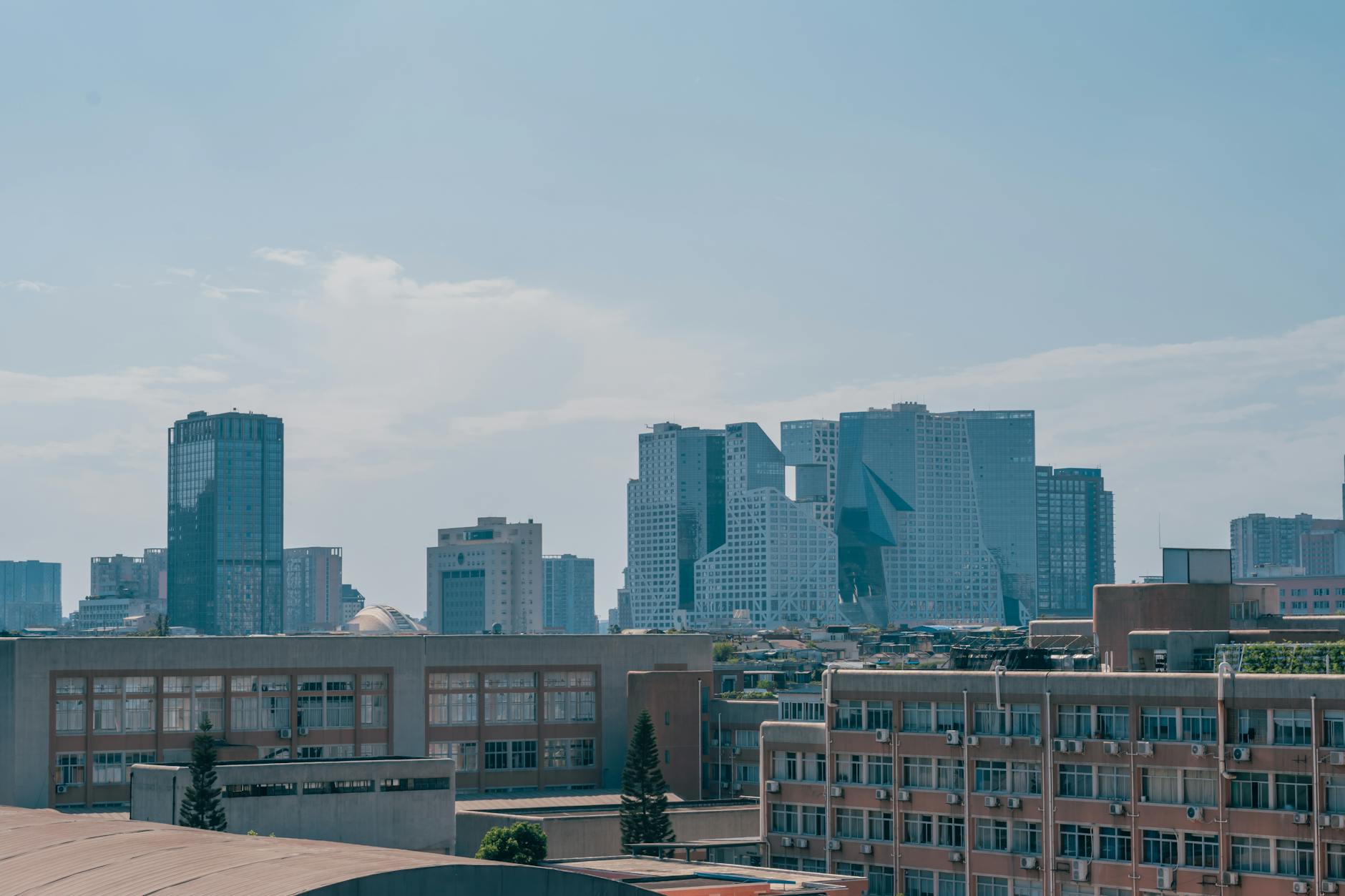 Modern office buildings in downtown financial district representing family office relocations