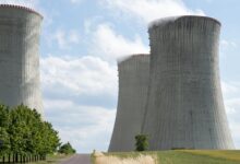 Nuclear power plant cooling towers against blue sky