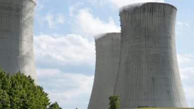 Nuclear power plant cooling towers against blue sky