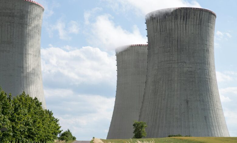 Nuclear power plant cooling towers against blue sky