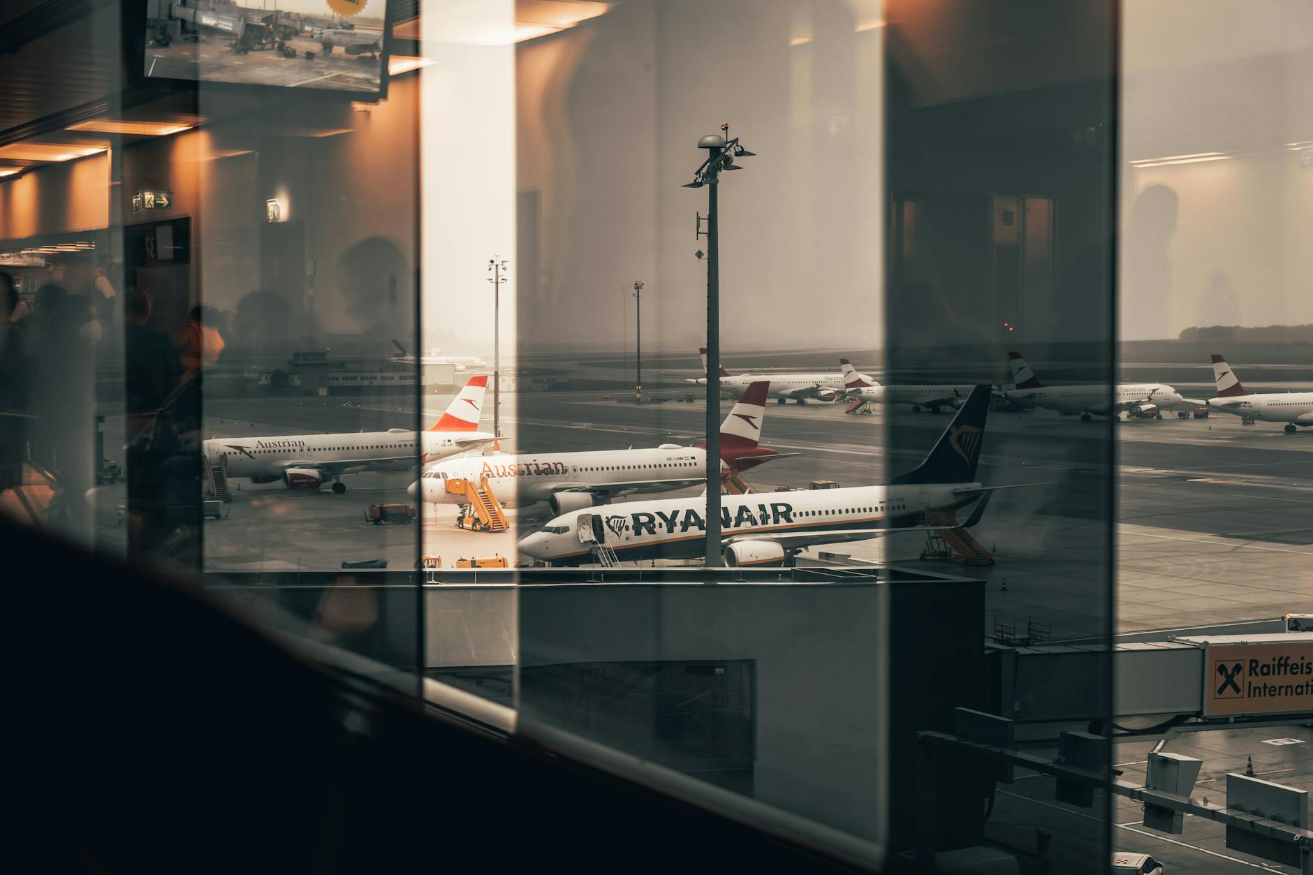 Business travelers in airport terminal preparing for corporate travel