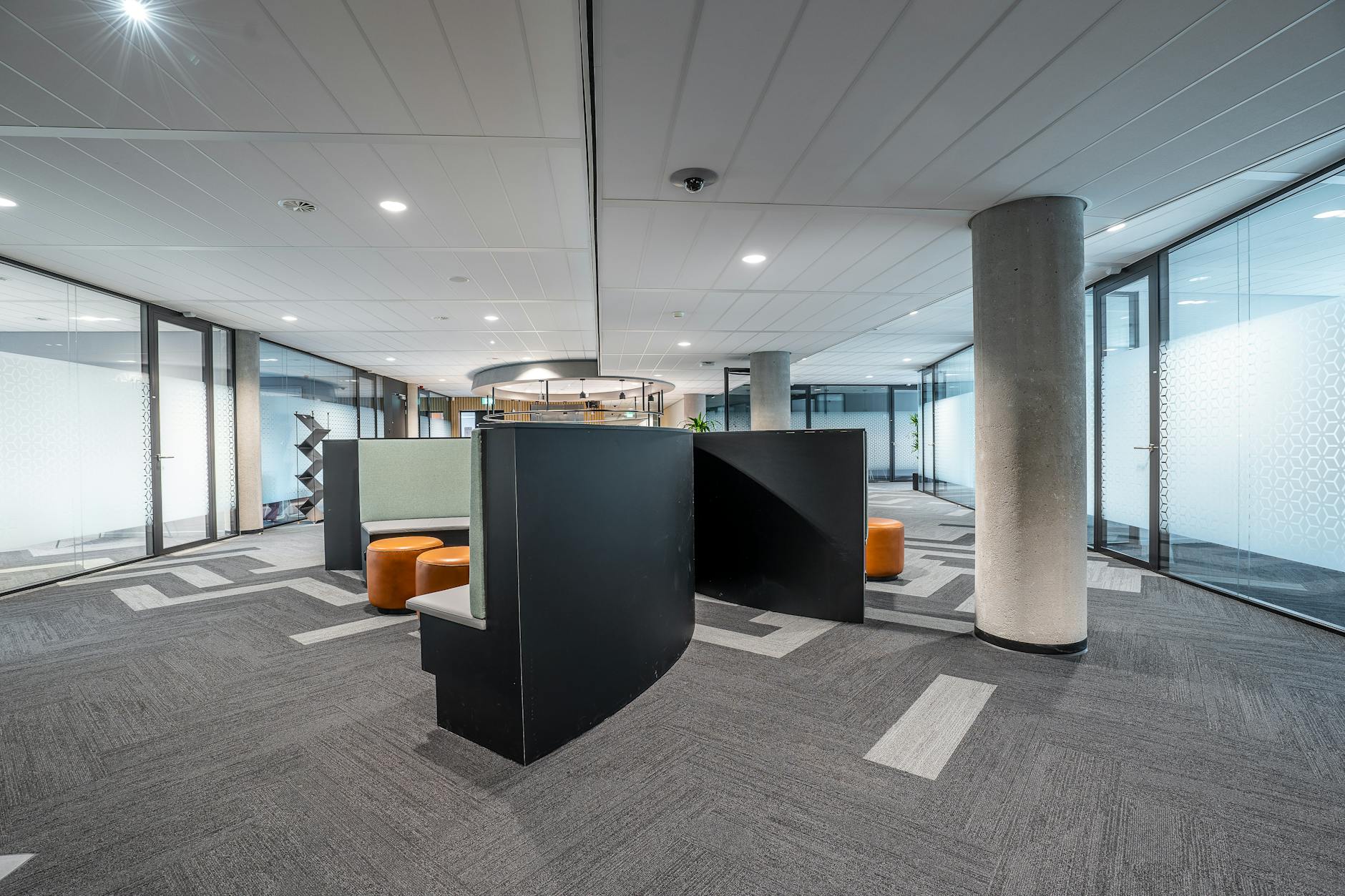 Modern bank interior with teller windows and customer service area