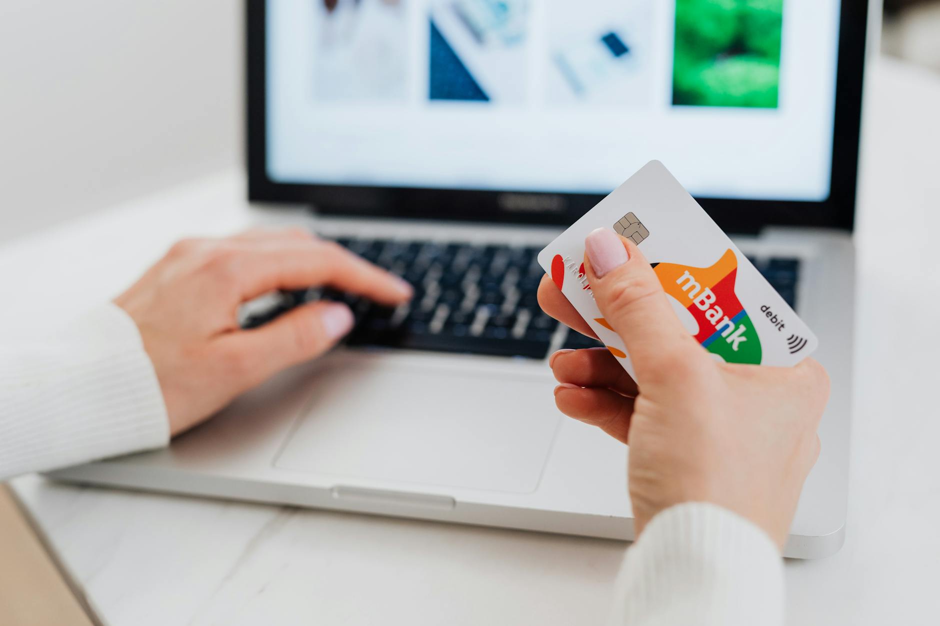 Person using smartphone for digital banking transactions on screen