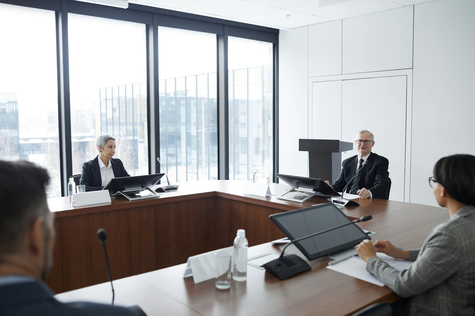 Investment professionals reviewing financial documents in conference room