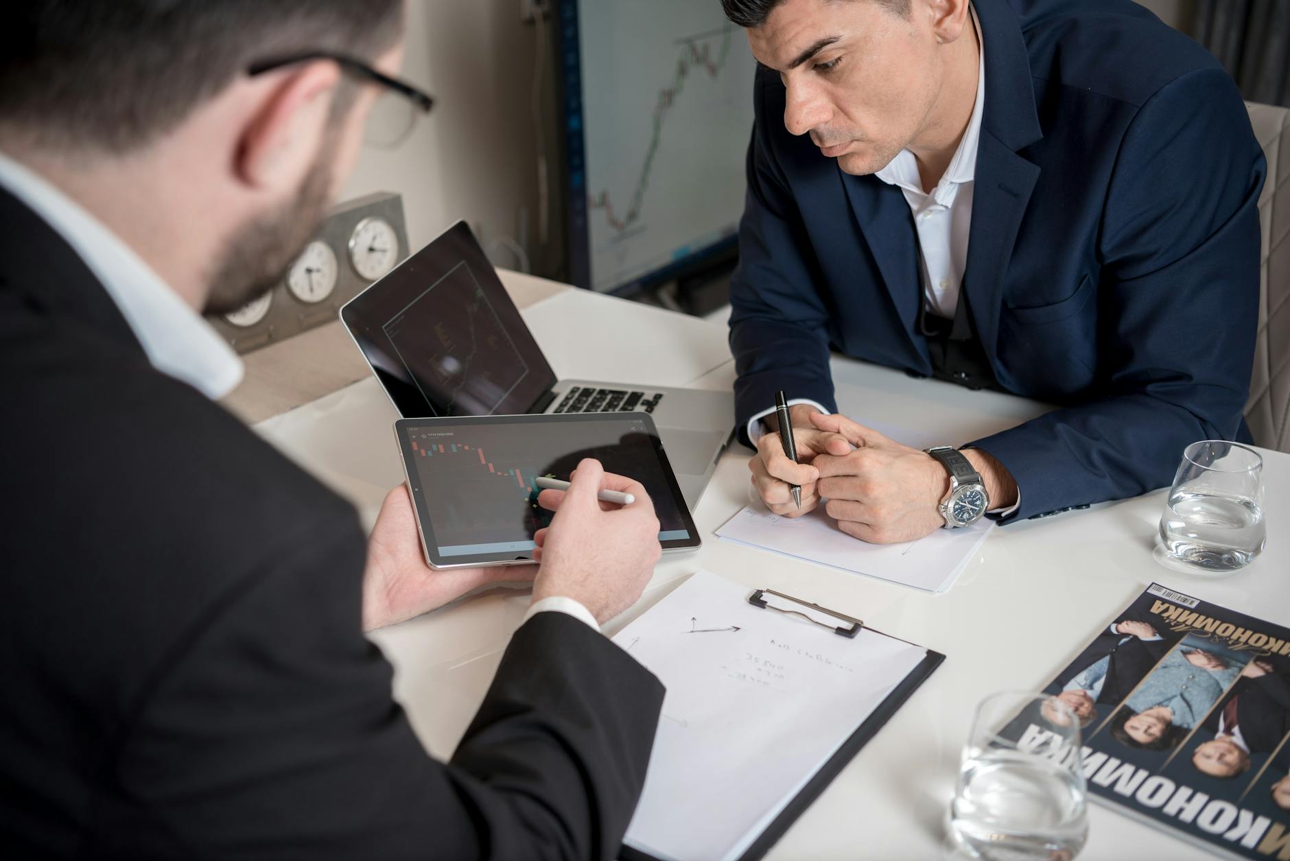 Institutional investors reviewing long-term asset allocation strategy in a formal meeting setting