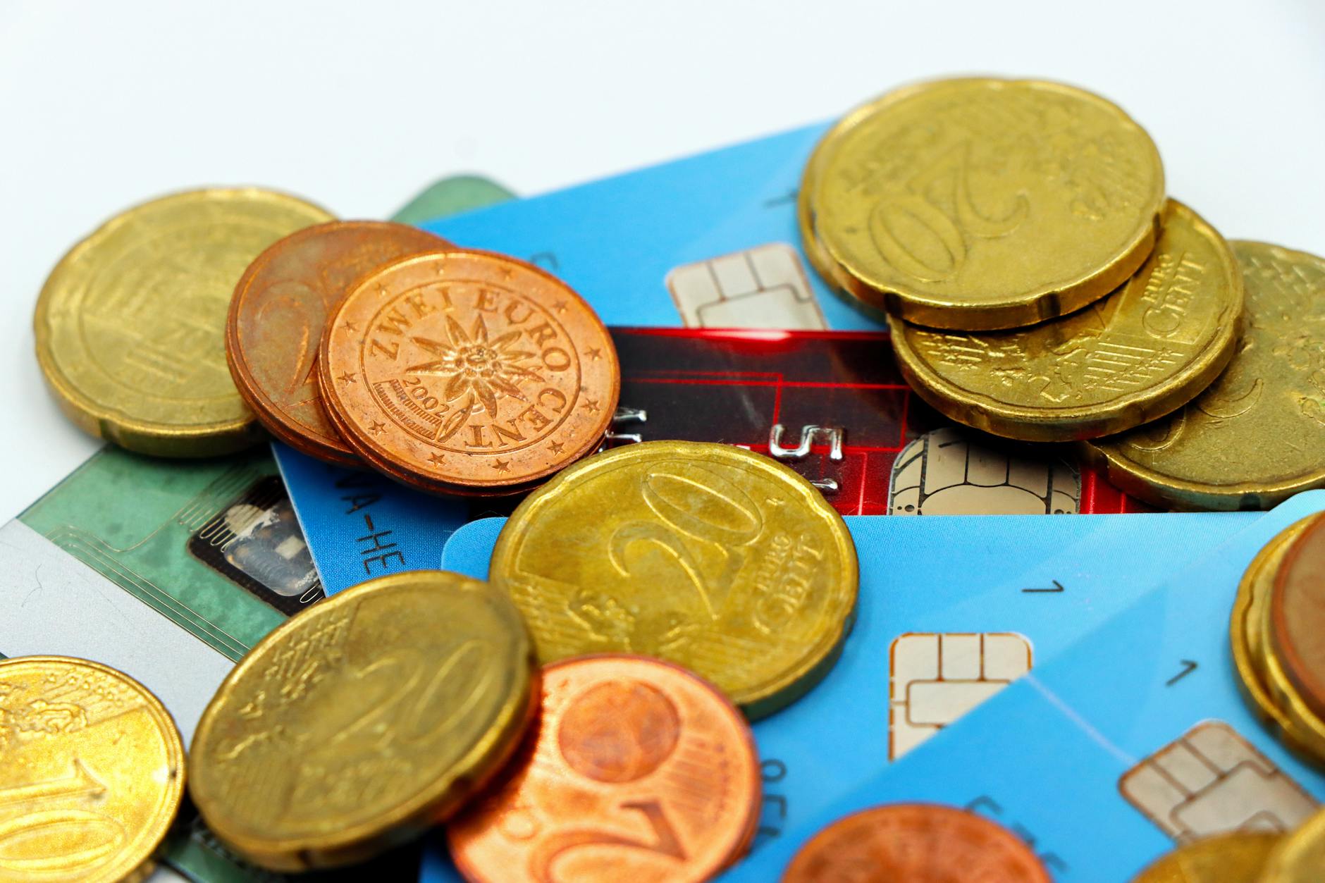 Retirement savings concept with coins and financial planning materials on a table