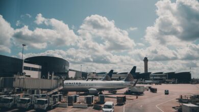 Empty airport terminal with gates and large windows showing parked aircraft