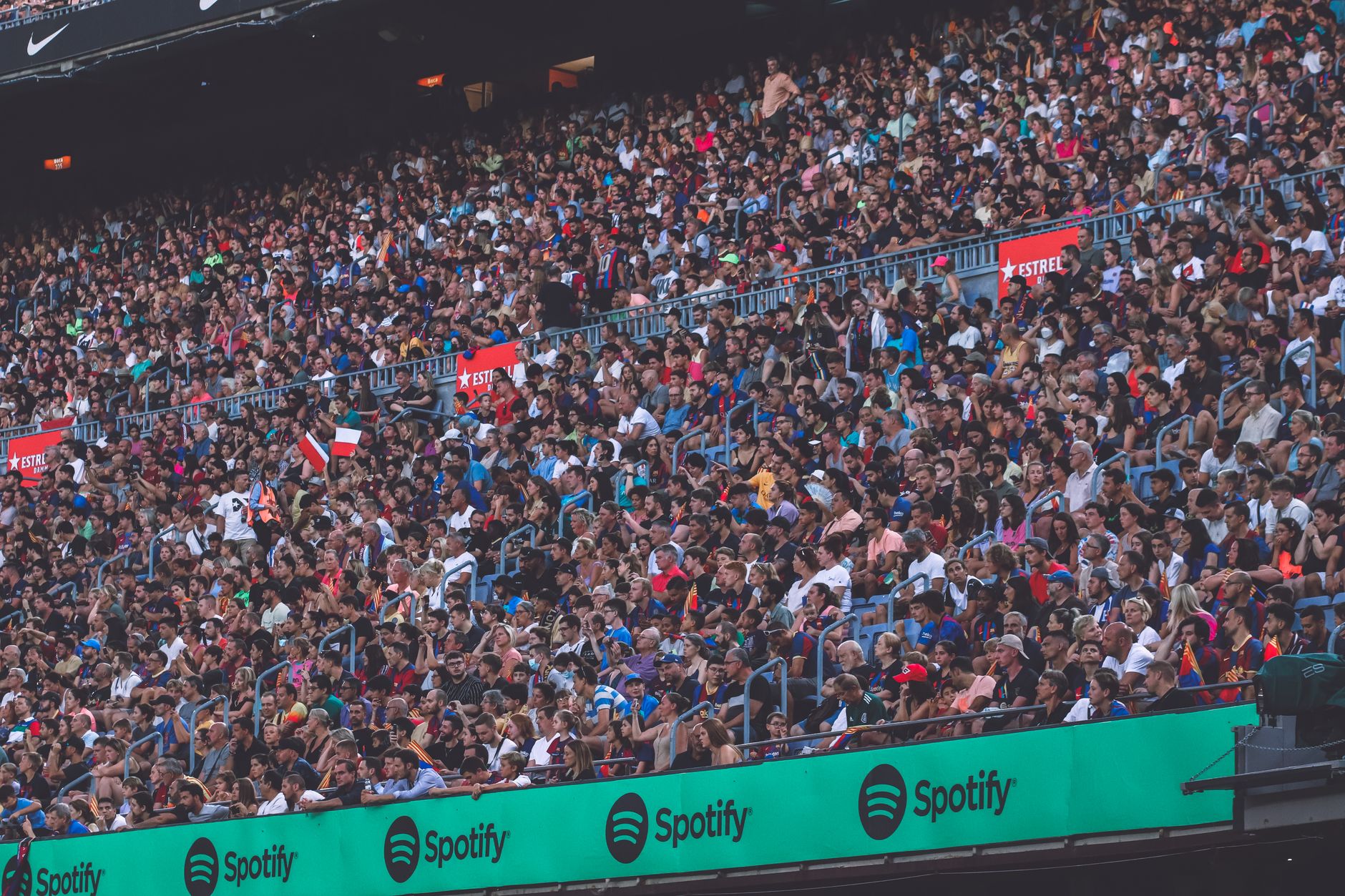 Large crowd filling a college football stadium during a game