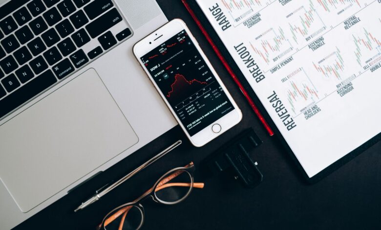 Traders working at a financial desk analyzing bond market data on multiple screens