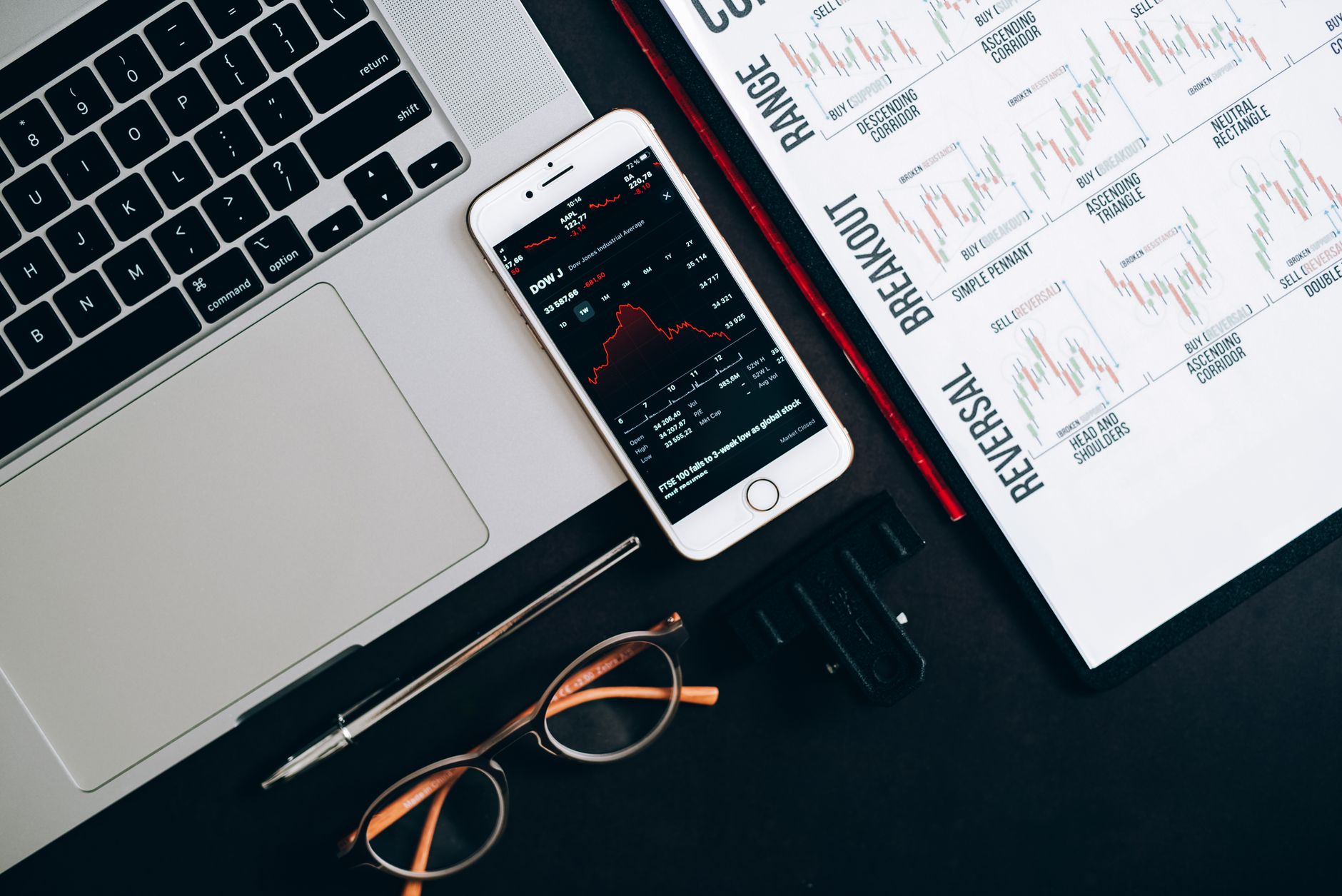 Traders working at a financial desk analyzing bond market data on multiple screens