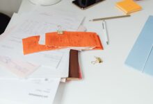 Financial documents and bond paperwork spread across a desk representing structured credit analysis