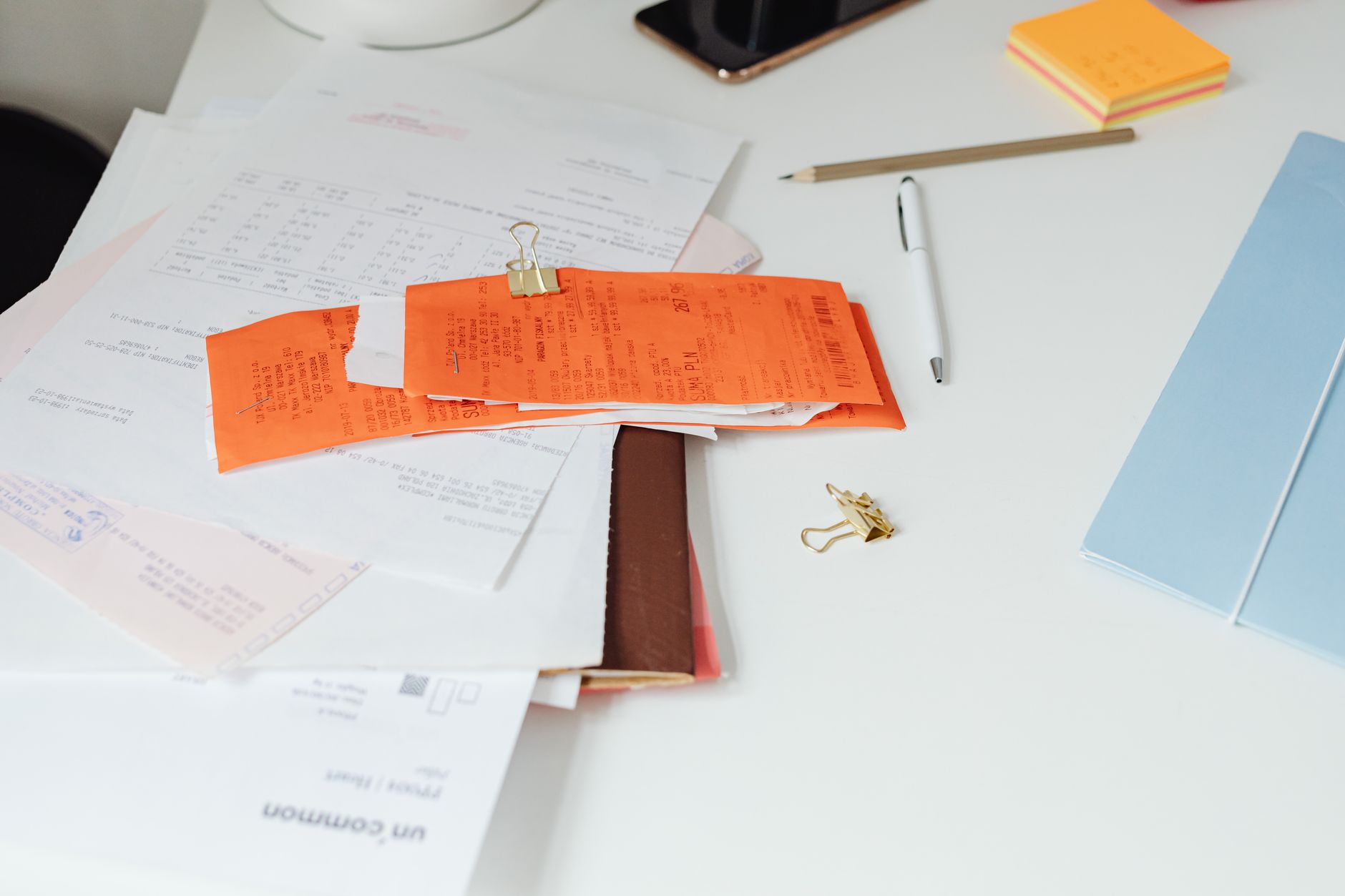 Financial documents and bond paperwork spread across a desk representing structured credit analysis