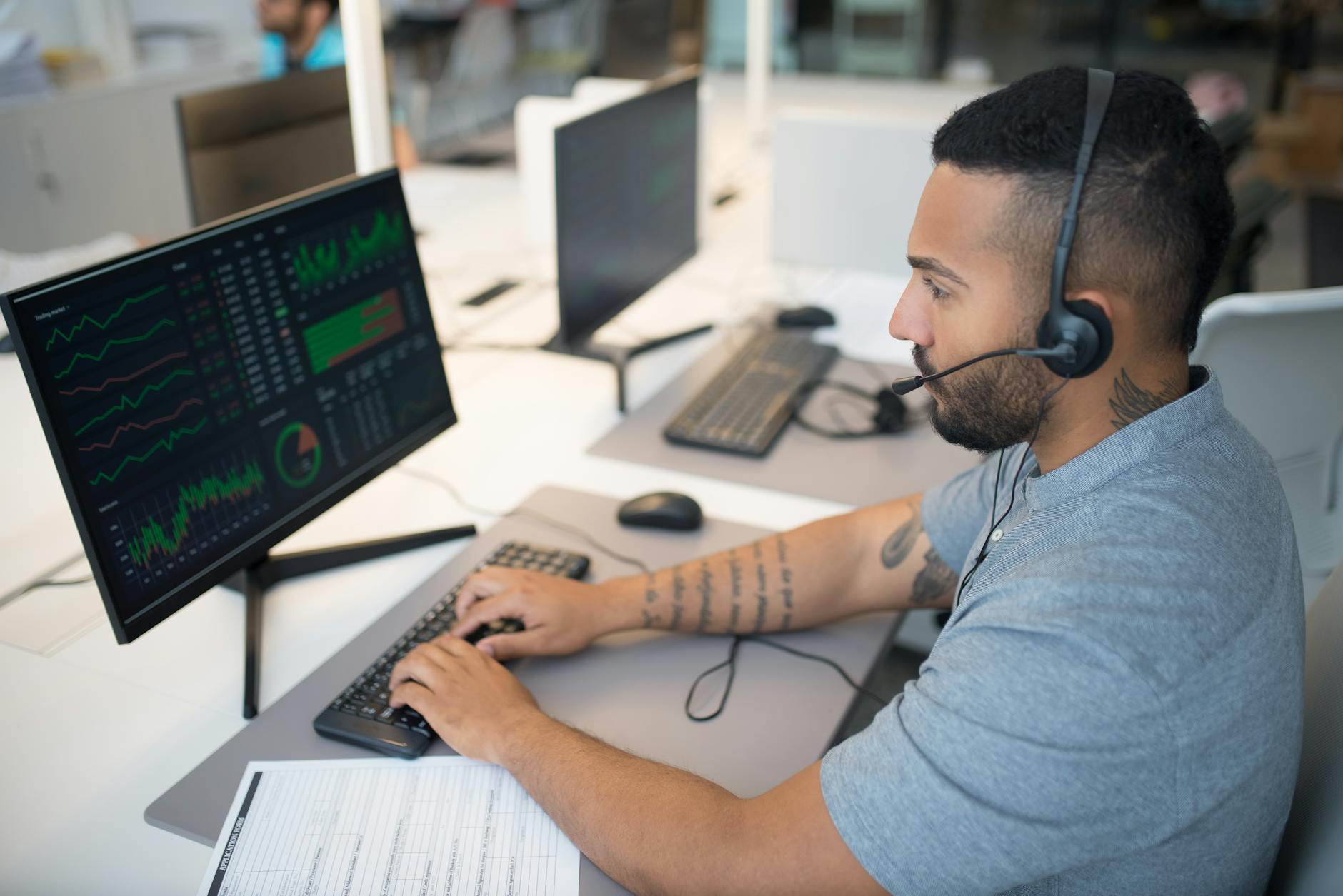 Traders monitoring commodity futures screens at a financial trading desk