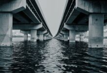 Large infrastructure bridge under construction representing sovereign fund investment in physical assets