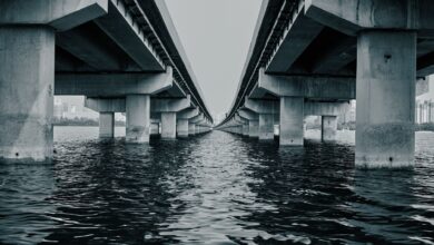 Large infrastructure bridge under construction representing sovereign fund investment in physical assets