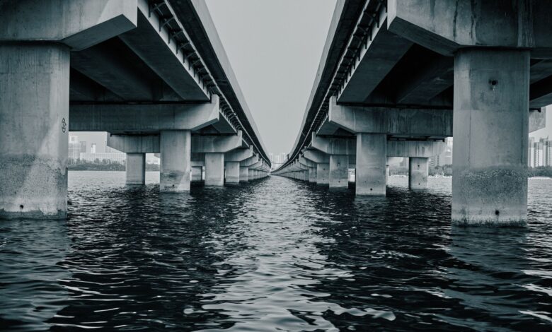 Large infrastructure bridge under construction representing sovereign fund investment in physical assets