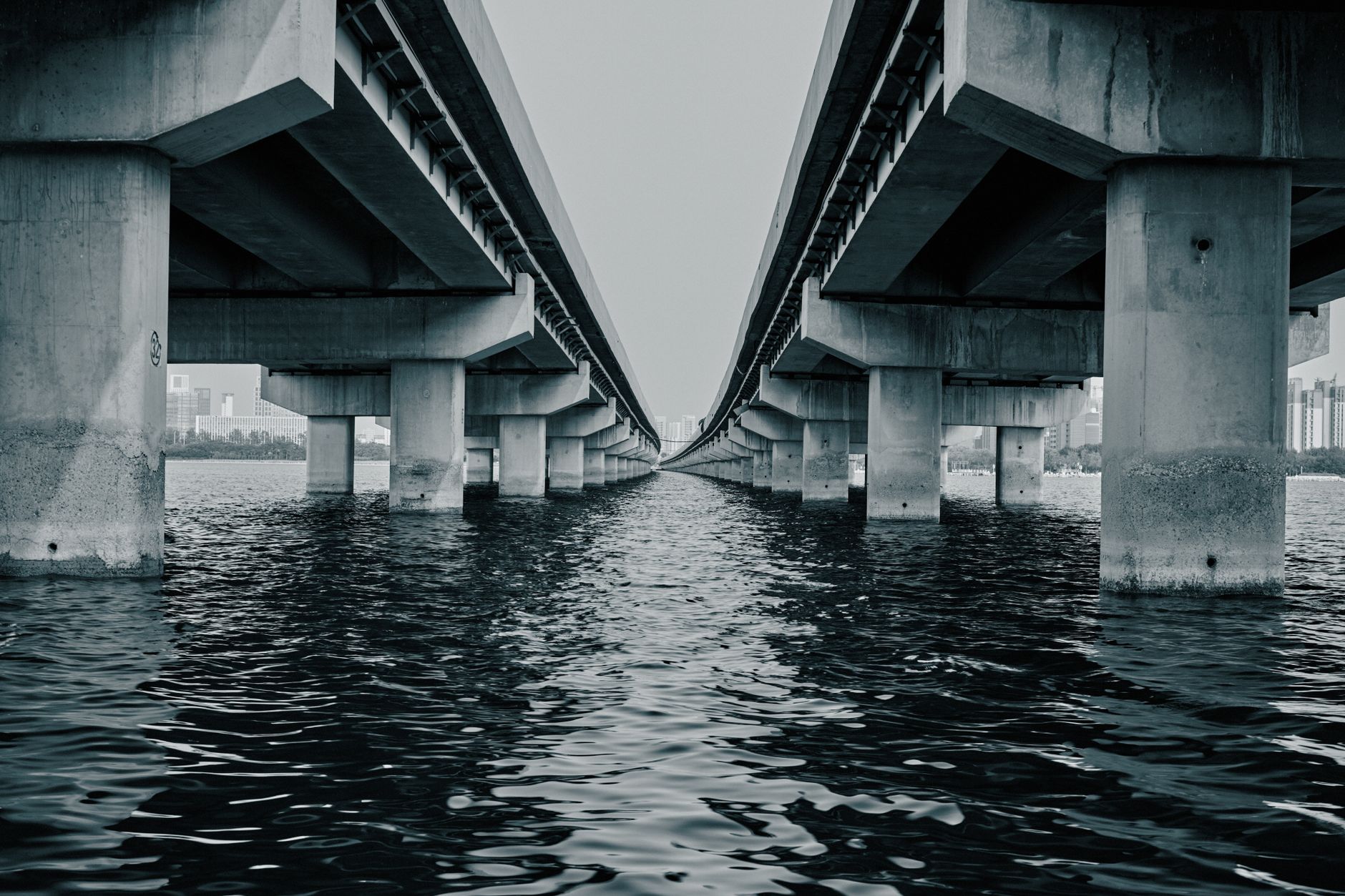 Large infrastructure bridge under construction representing sovereign fund investment in physical assets