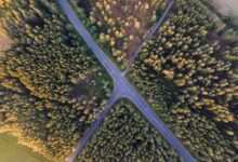 Aerial view of a major toll highway interchange with multiple lanes of traffic