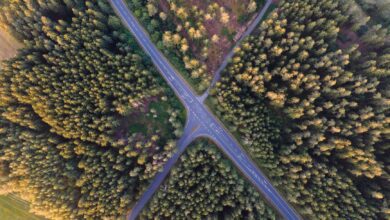 Aerial view of a major toll highway interchange with multiple lanes of traffic