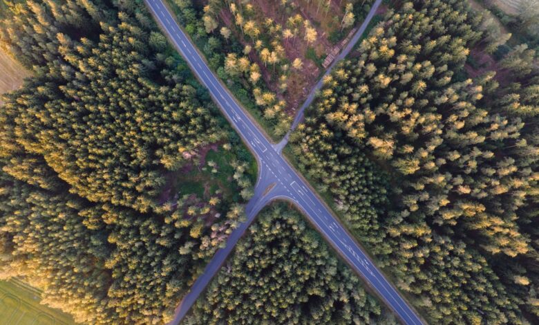 Aerial view of a major toll highway interchange with multiple lanes of traffic
