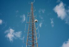 Aerial view of a broadcast communications tower standing in an open landscape
