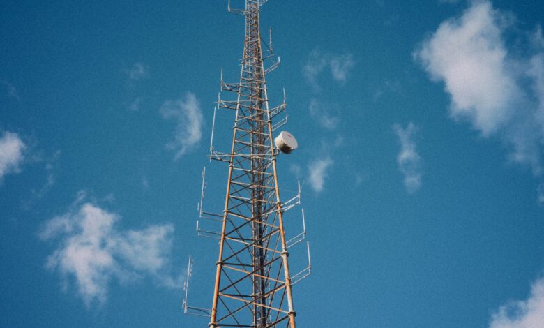 Aerial view of a broadcast communications tower standing in an open landscape