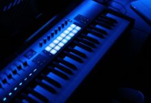 Recording studio with mixing board and microphone representing music intellectual property assets