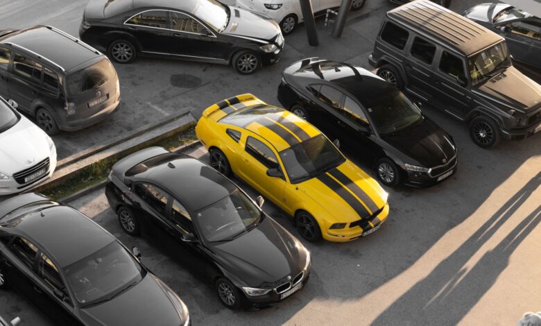 Large rental car fleet parked in a lot representing asset-backed securitization collateral