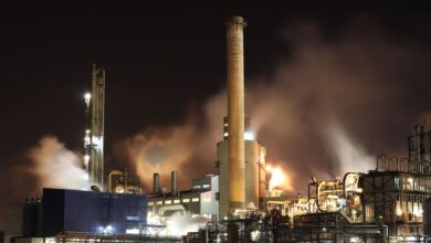 Industrial facility with large smokestacks used in carbon capture operations