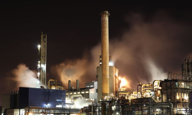 Industrial facility with large smokestacks used in carbon capture operations