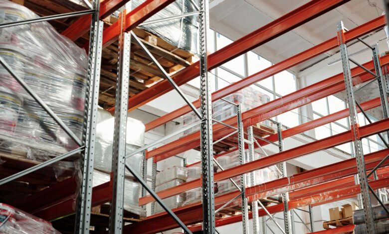 Large industrial warehouse interior with high shelving and open floor space
