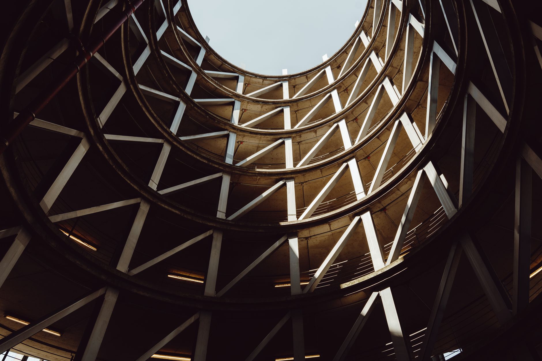 Multi-level urban parking garage structure viewed from below