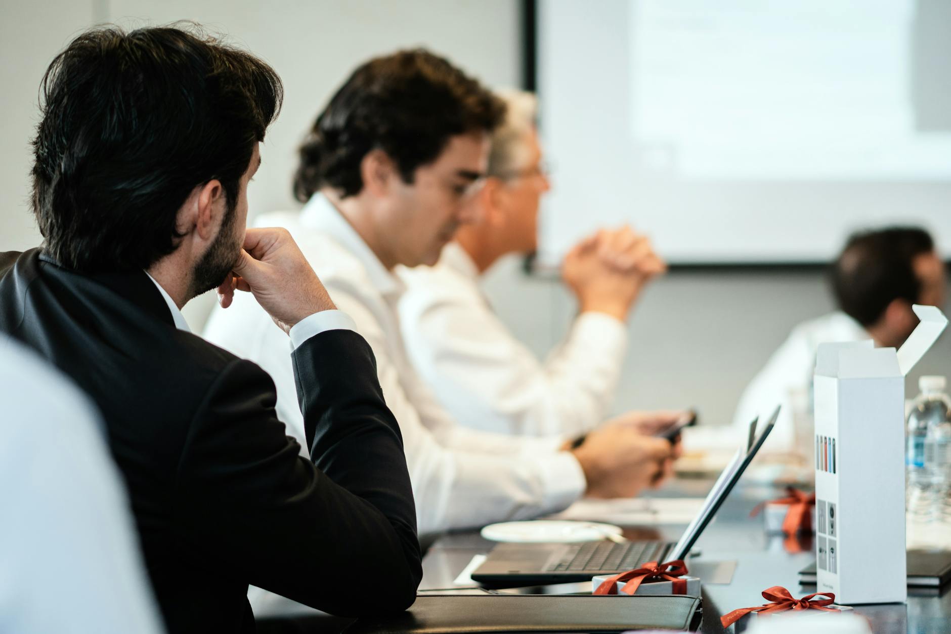 Business professionals reviewing fund documents in a conference room
