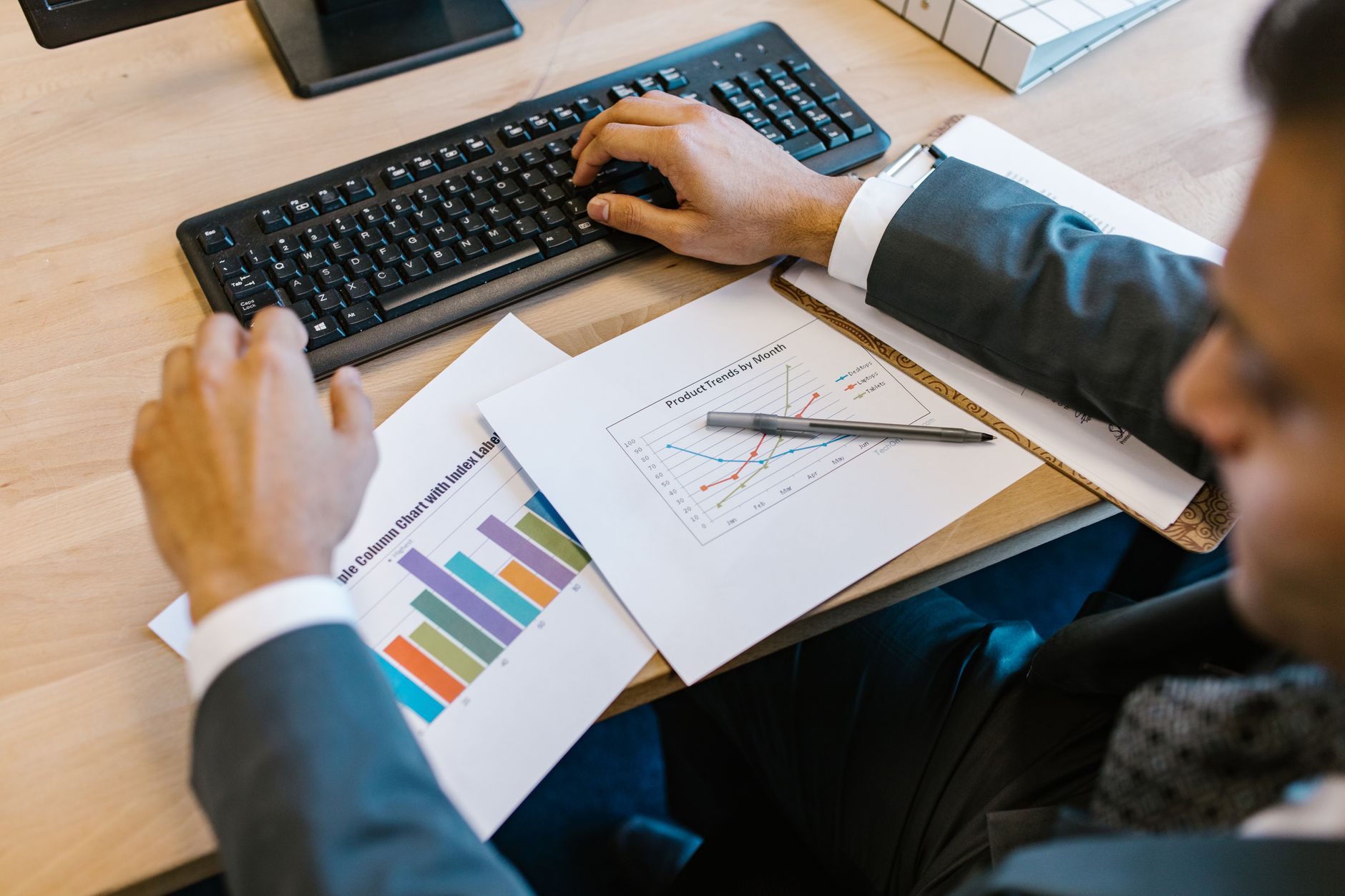 Financial analyst reviewing loan portfolio data and yield charts