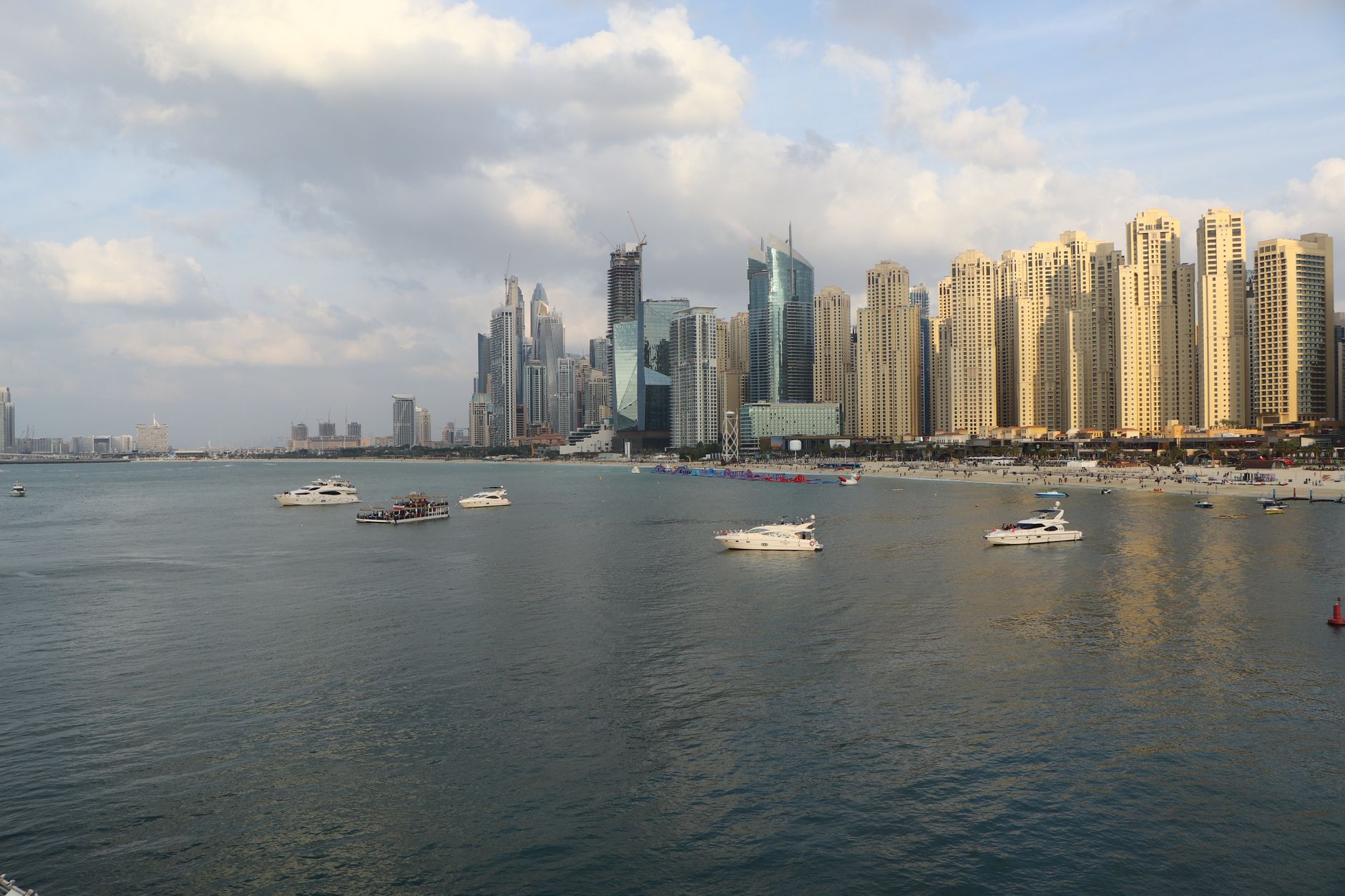 High-rise luxury apartment towers against a city skyline