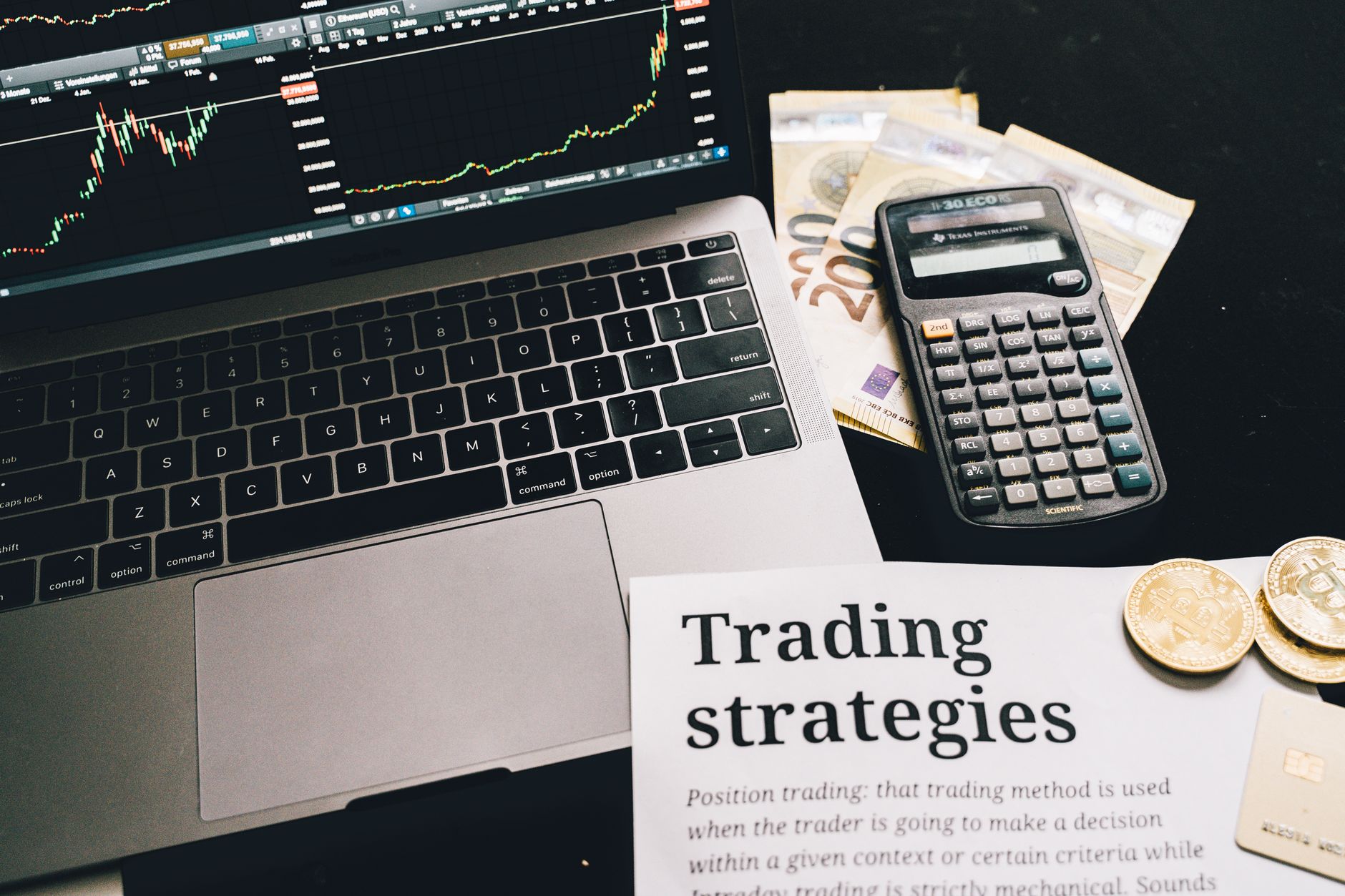 Financial traders monitoring screens showing market data and asset prices