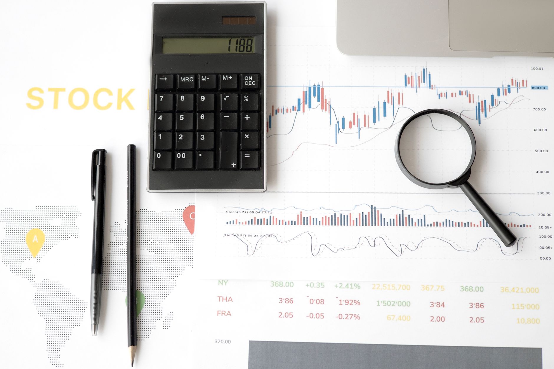 Financial charts and data screens showing investment portfolio analysis
