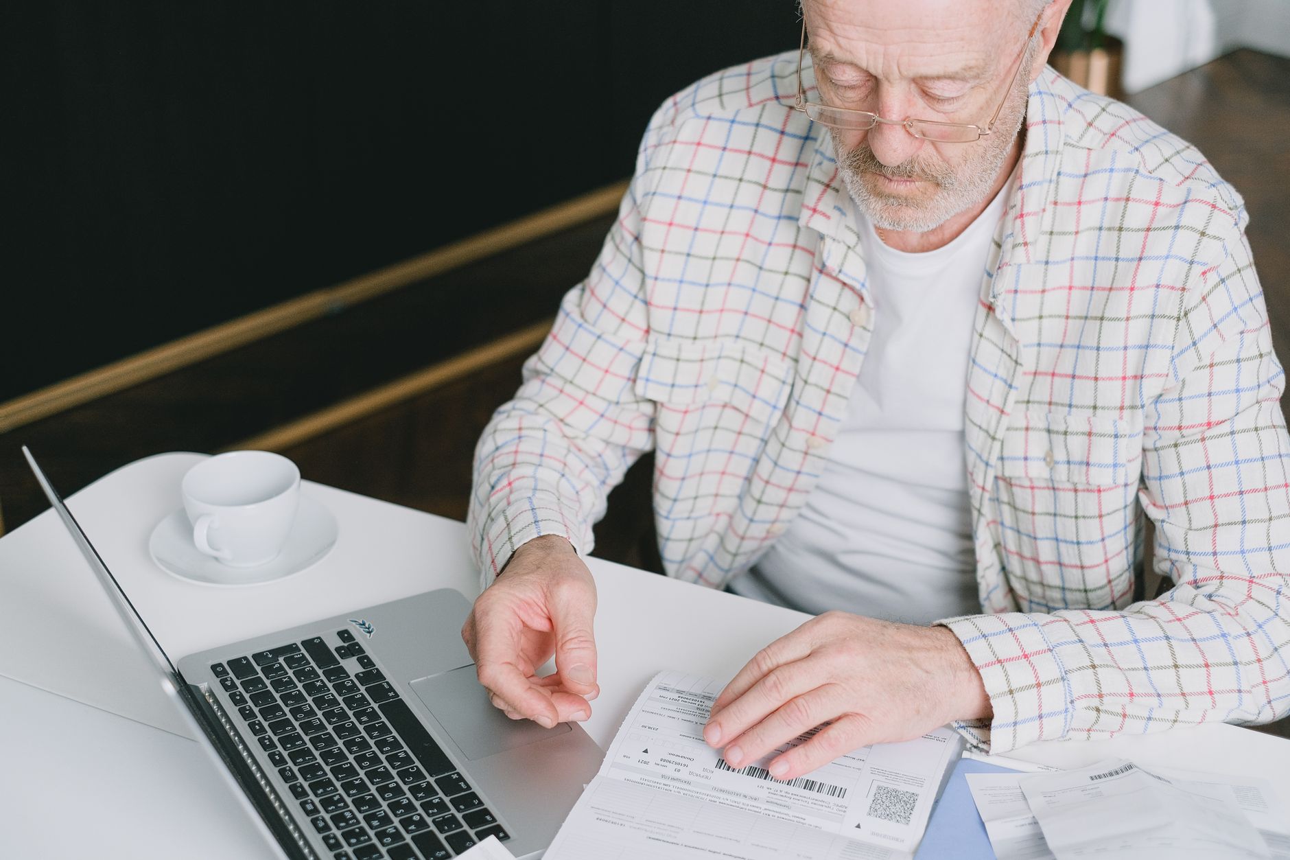 Financial professionals reviewing investment portfolio documents at a conference table