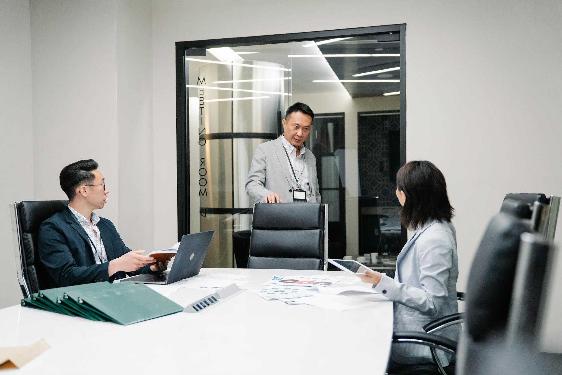 Private wealth management office interior with professionals in discussion
